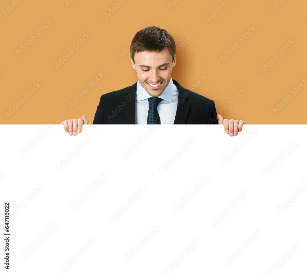 Business man professional bank manager in confident black suit. Businessman stand behind hang over, look at empty white banner signboard with copy space. Isolate on brown beige background Business man professional bank manager in confident black suit. Businessman stand behind hang over, look at empty white banner signboard with copy space. Isolate on brown beige background