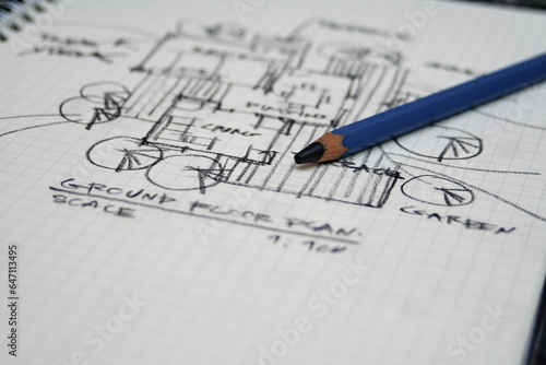 sketching architectural plans with pencils on a sketchbook on a desk, sketch design, architect, freehand, architectural drafting.