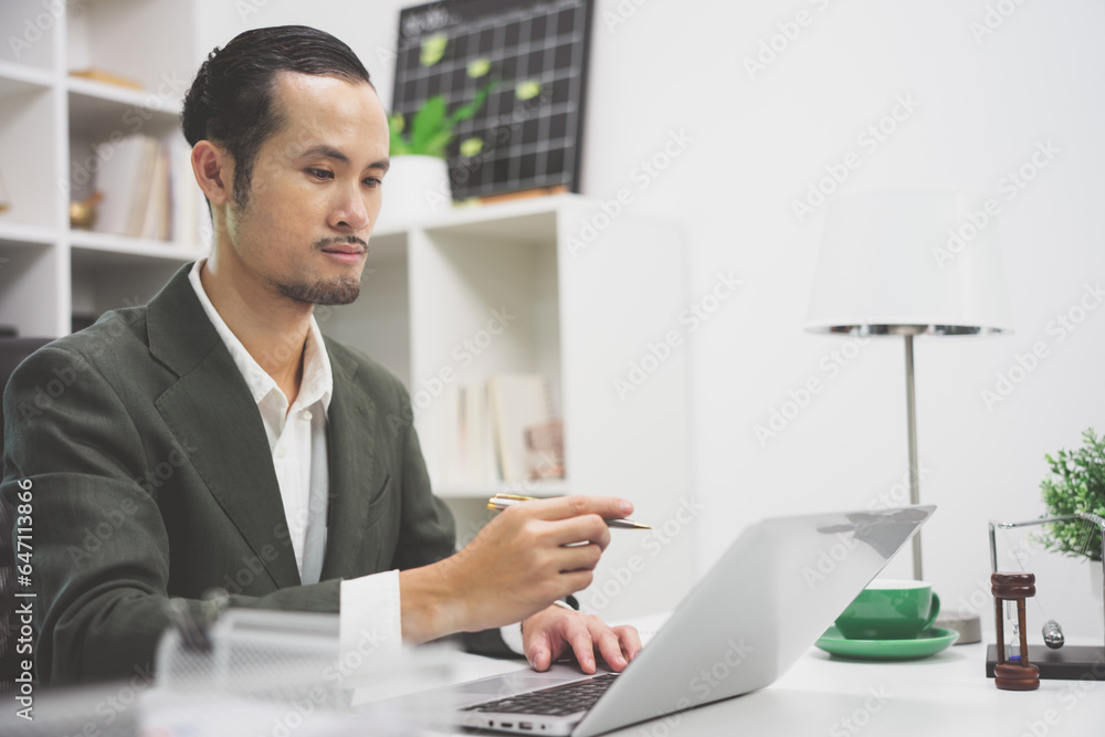 Handsome young ambitious developer working alone at the office Handsome young ambitious developer working alone at the office