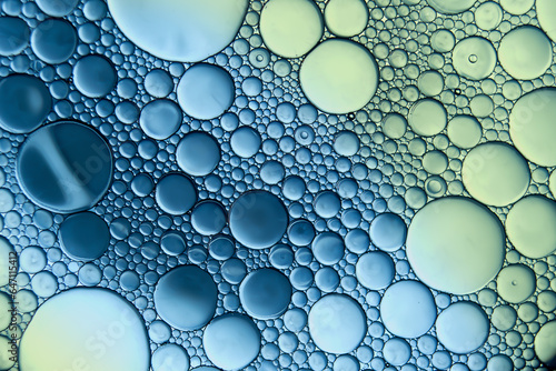 Macrophoto of oil droplets and bubbles on a water surface