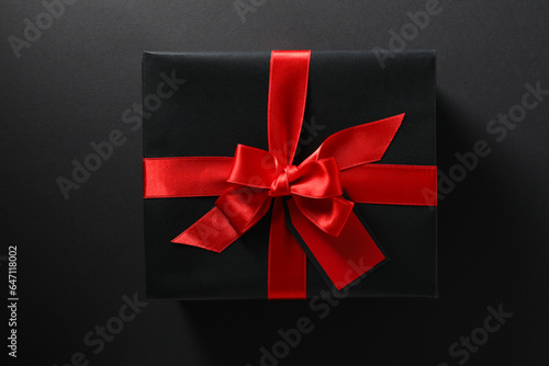 The concept of black friday, a gift in a black wrapper.