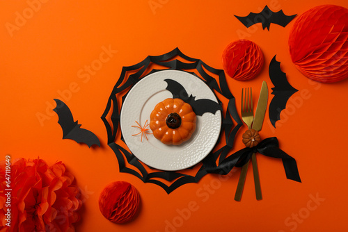 Table setting for Halloween, decorations with spiders and pumpkins