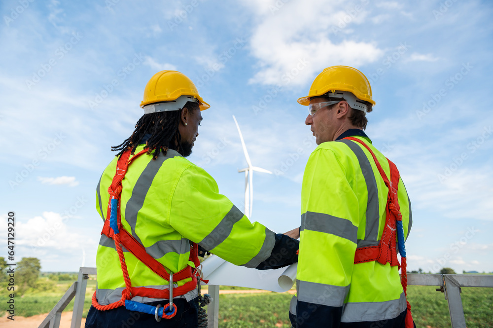 Engineering people are meeting at electrical turbines field, Engineering people, corporate working, teamwork concept Engineering people are meeting at electrical turbines field, Engineering people, corporate working, teamwork concept