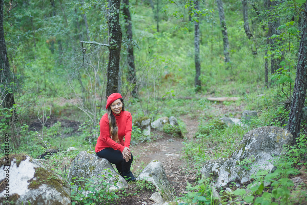 Woman with a positive attitude admiring the forest.