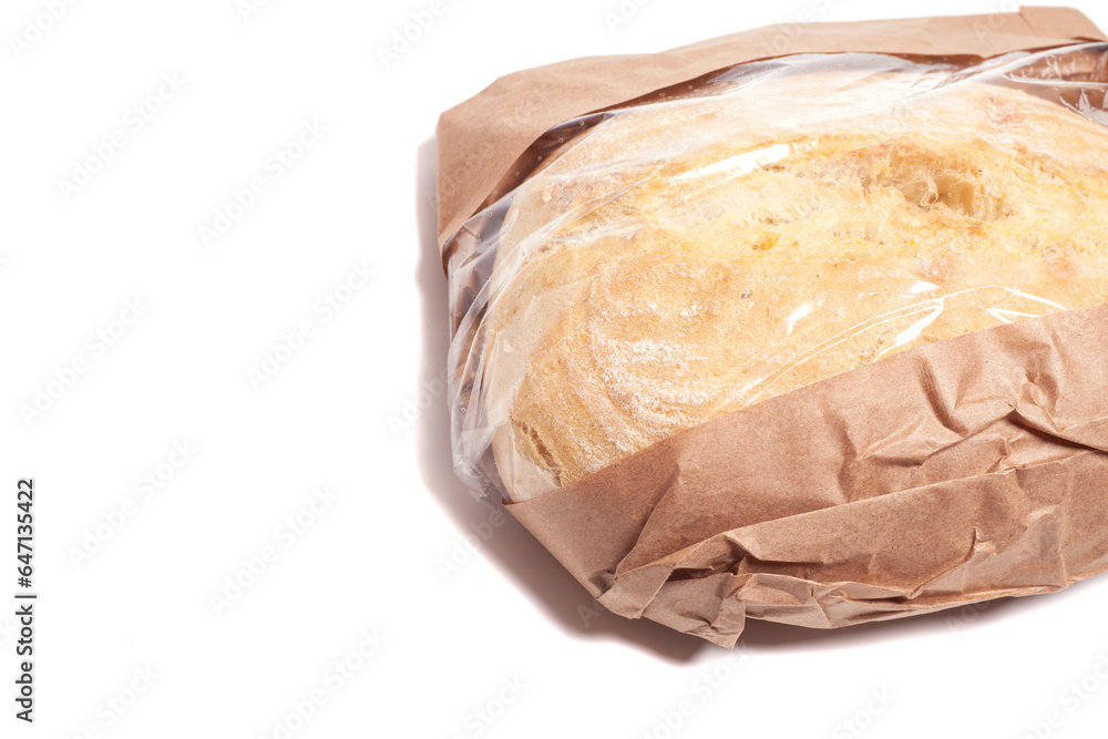 White bread in a paper bag isolated on white background. White bread in a paper bag isolated on white background.