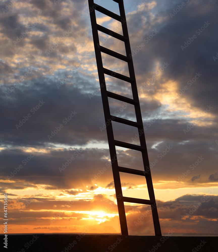 photo of stairway to heaven. metal, iron ladder or the way to heaven, the concept of enlightenment and spirituality. Stairway leading up to bright sunrise, sunset cloudy sky. next level idea, concept