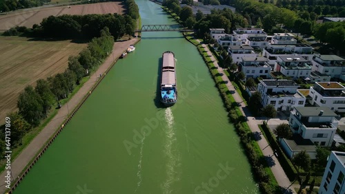 barge floats on the channel, water logistics, cargo transportation. Bad Essen, Germany. 9.09.2023 photo