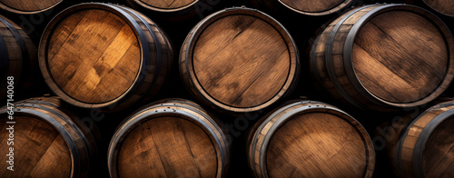 Wooden wine barrels in a cellar, creating an ambiance of rustic winemaking tradition
