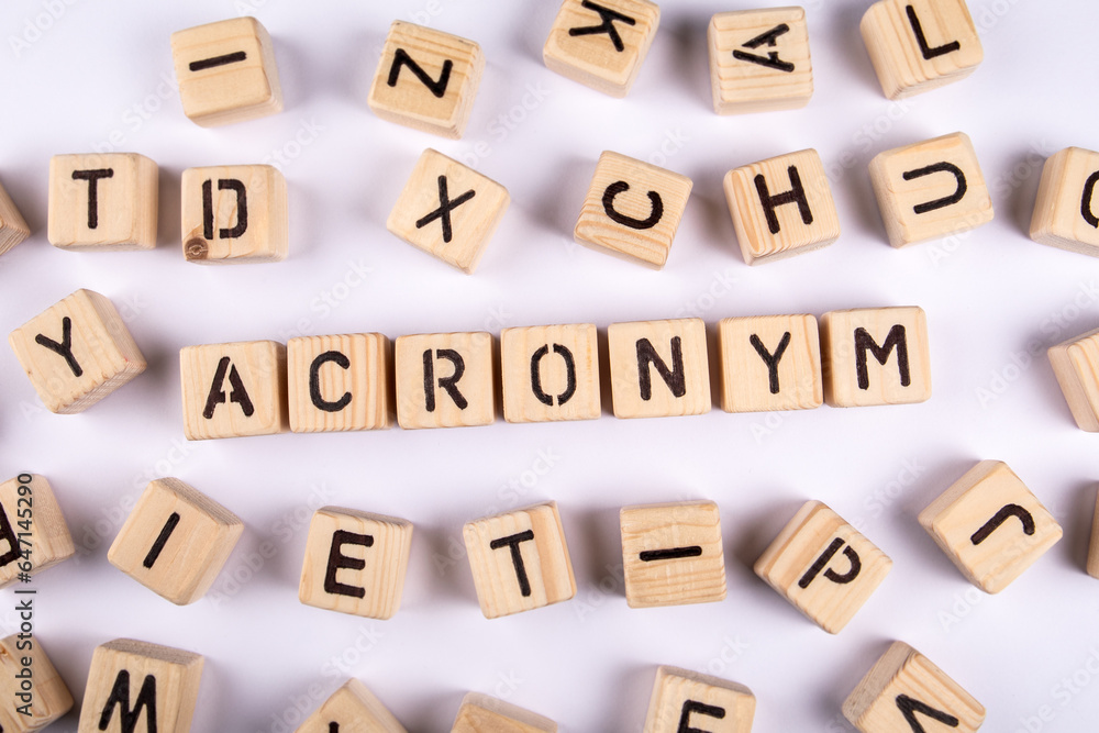 ACRONYM Concept. Wooden alphabet blocks on a white background ACRONYM Concept. Wooden alphabet blocks on a white background