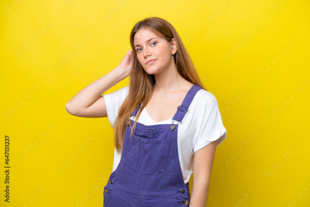 Young caucasian woman isolated on yellow background having doubts Young caucasian woman isolated on yellow background having doubts