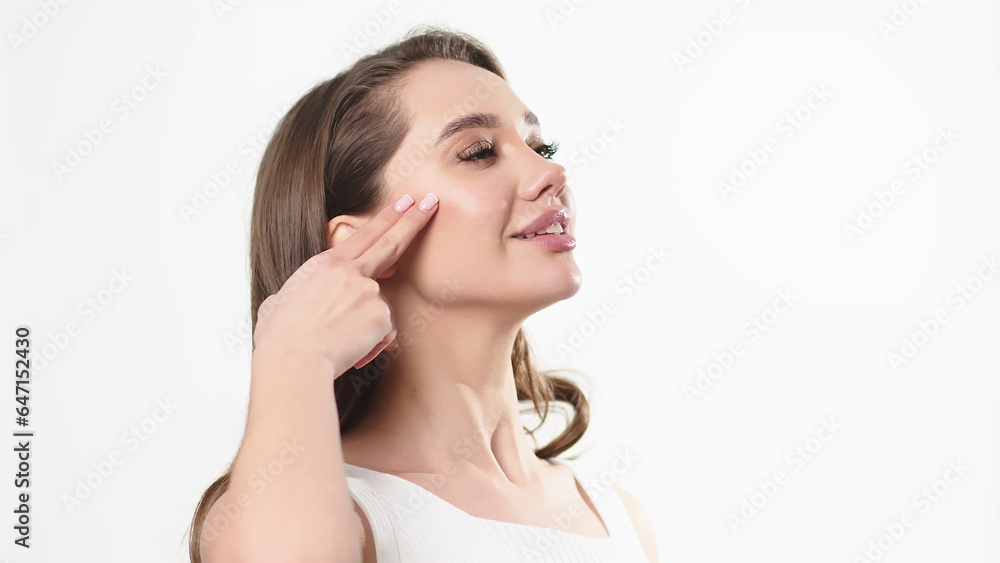Beautiful young woman with clean fresh skin touching her own face. Facial treatment. Cosmetology, beauty and spa. Beautiful young woman with clean fresh skin touching her own face. Facial treatment. Cosmetology, beauty and spa.
