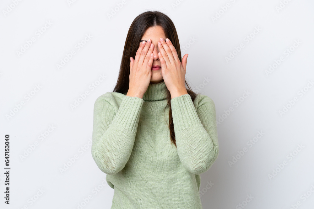 Young Brazilian woman isolated on white background covering eyes by hands Young Brazilian woman isolated on white background covering eyes by hands