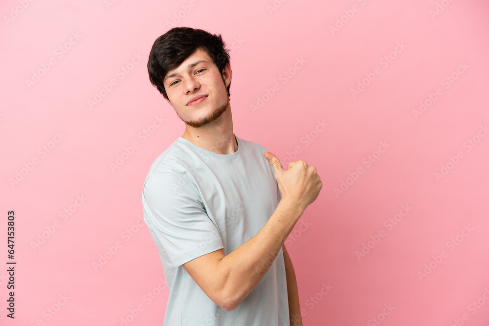 Young Russian man isolated on pink background proud and self-satisfied Young Russian man isolated on pink background proud and self-satisfied