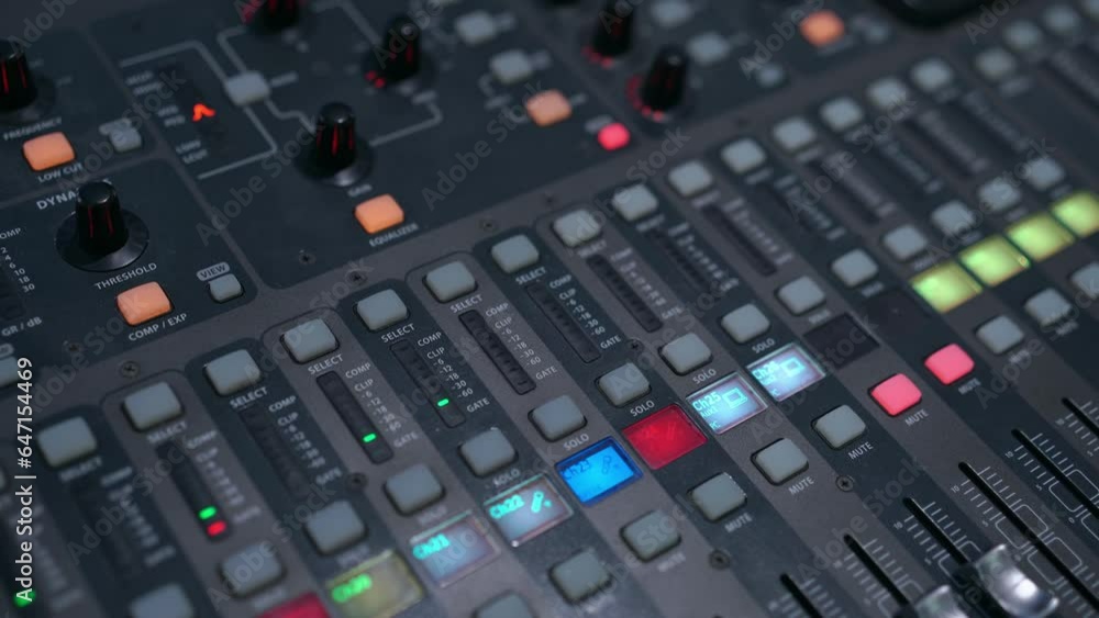 Professional audio mixing console. Mixer. Pro audio mixing board faders and knobs. Static shot of multi-track music recording equipment faders and sliders.
Professional audio mixing console. Mixer. Pro audio mixing board faders and knobs. Static shot of multi-track music recording equipment faders and sliders.