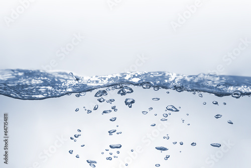 Water splash Aqua flowing in waves and creating bubbles Drops on the water surface feel fresh and clean isolated on white background. 
