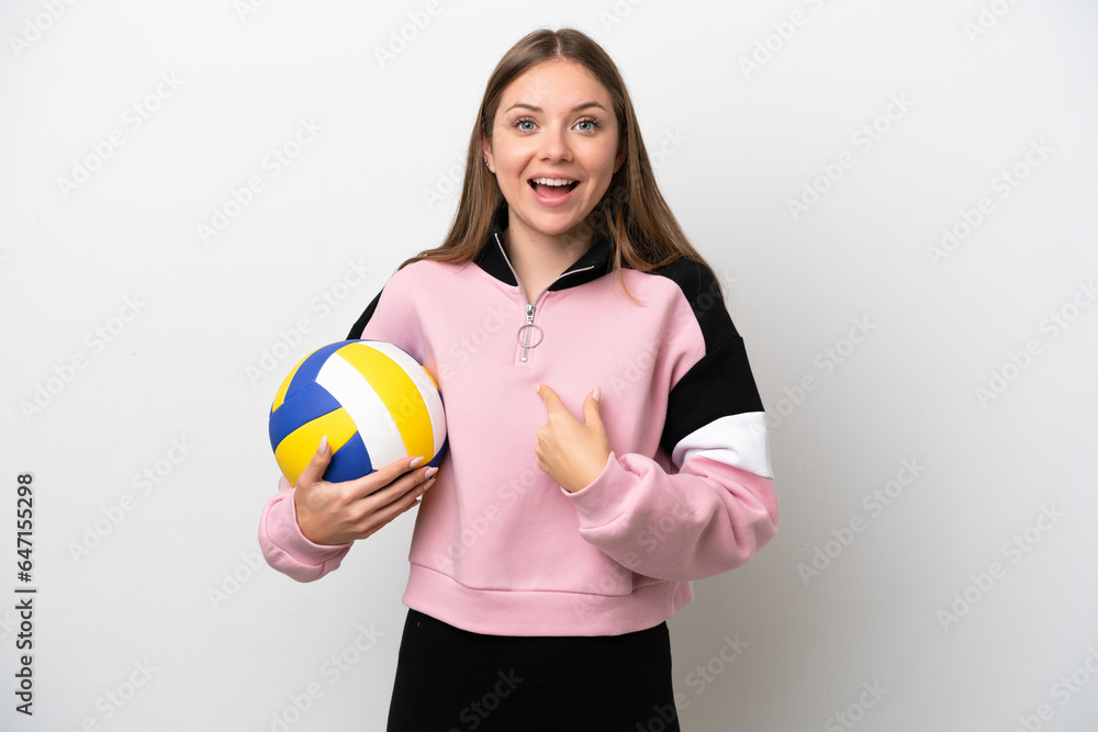 Young Lithuanian woman playing volleyball isolated on white background with surprise facial expression