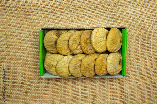Dried figs protoben on table in box top view