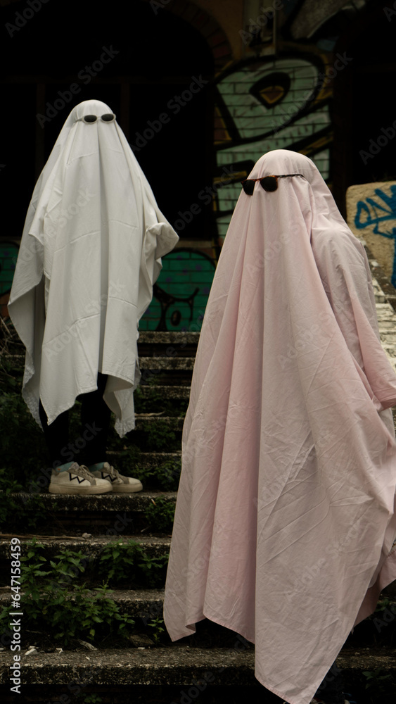 two people in a ghost costume with sunglasses. Trend