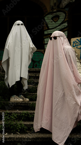 two people in a ghost costume with sunglasses. Trend