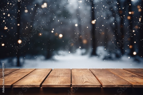 Empty wooden table outdoors, blur trees and snowfall, Winter background, template