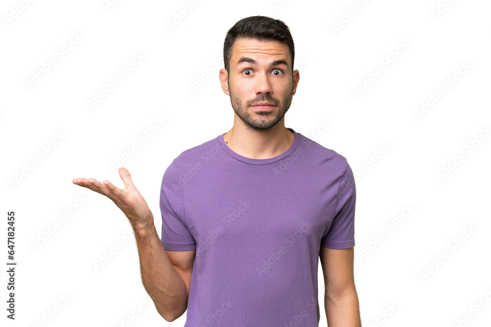 Young handsome caucasian man over isolated background making doubts gesture Young handsome caucasian man over isolated background making doubts gesture