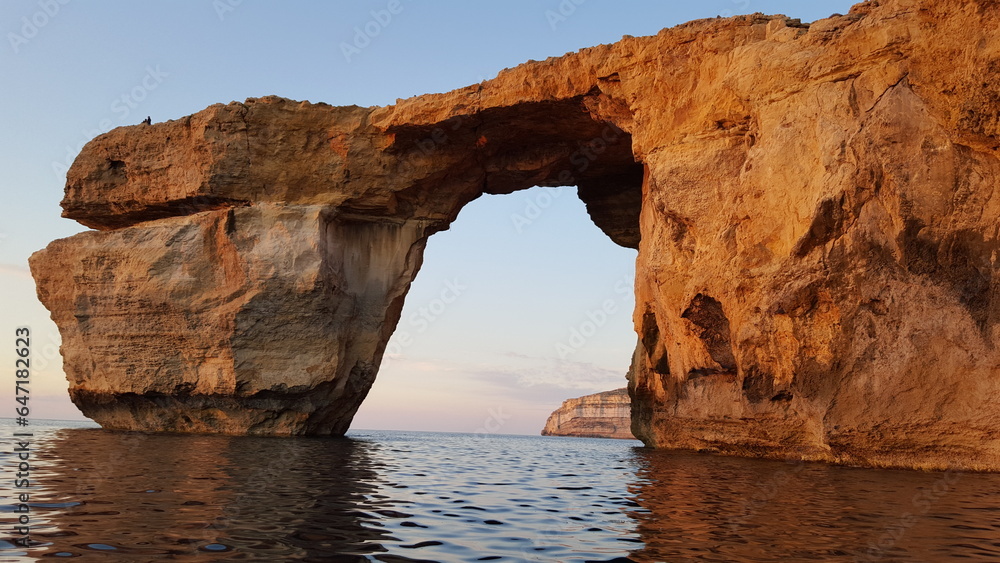 A towering, majestic portal risen from the waves, Azure window, Malta, Europe