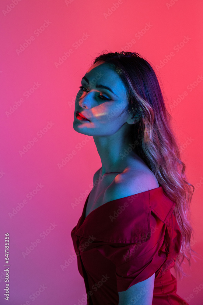 Young lady in studio with light illuminating face