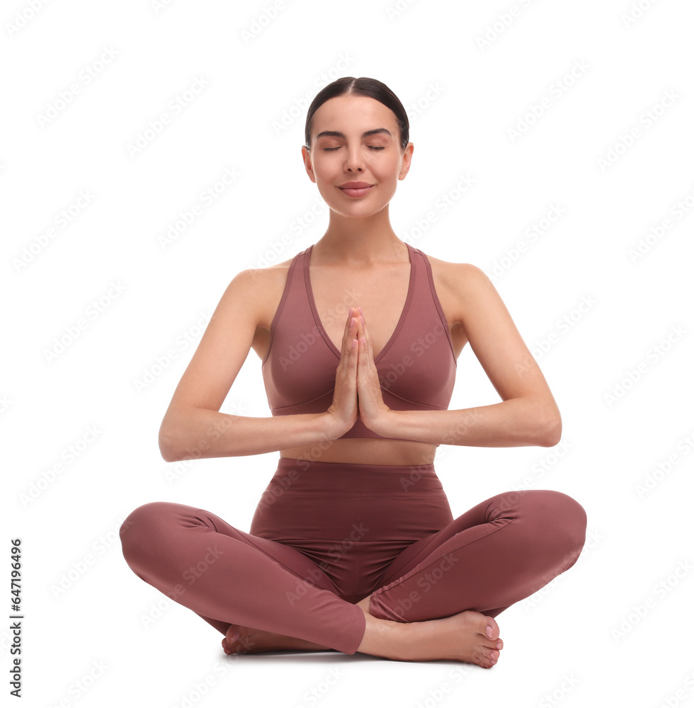 Beautiful young woman practicing yoga on white background. Lotus pose
