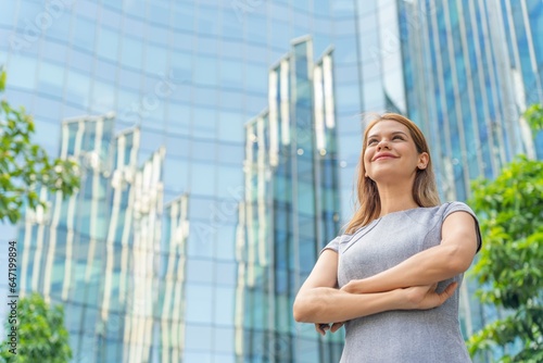 Valokuva Portrait of a successful Caucasian businesswoman in front a modern office buildi