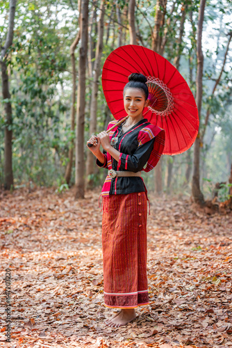 Asian Thai Northeast Woman Carrying Umbrella In Traditional Costume
