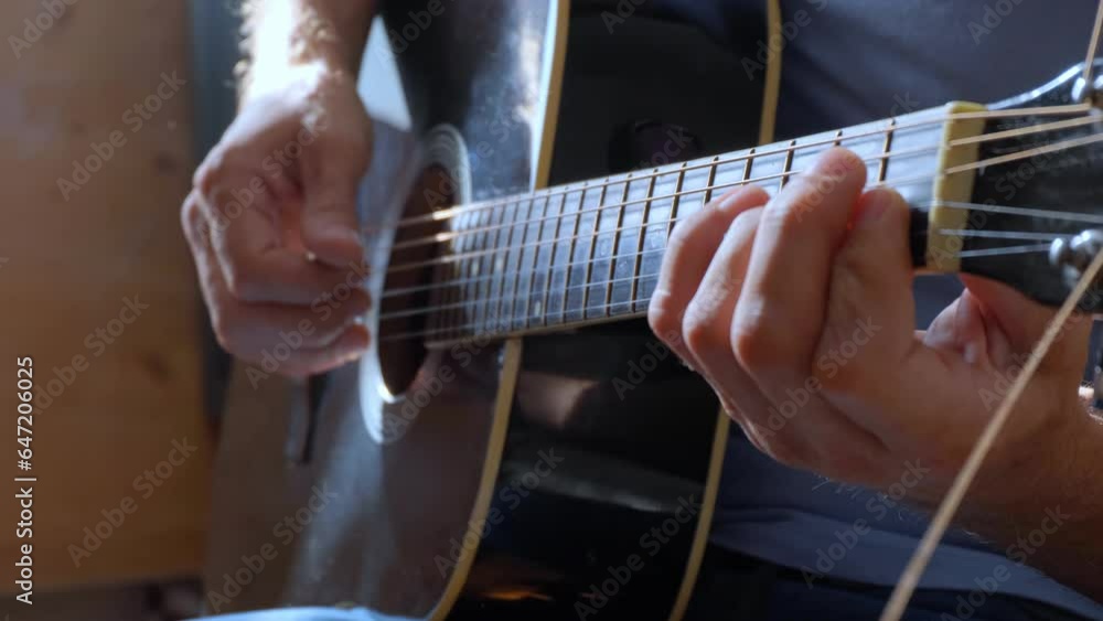 Man Playing Acoustic Guitar. Musician plays music. Slow motion. Man Playing Acoustic Guitar. Musician plays music. Slow motion.