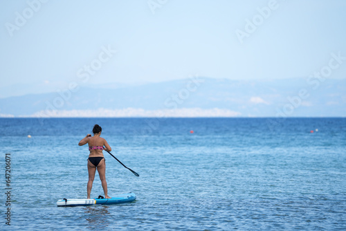 woman practicing a water sport. detail.