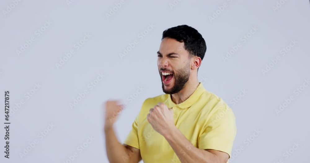 Excited, win and a man on a studio background for cheering, success or watching sports. Happy, winner and a person with celebration, achievement and crazy for a goal, announcement or good news Excited, win and a man on a studio background for cheering, success or watching sports. Happy, winner and a person with celebration, achievement and crazy for a goal, announcement or good news