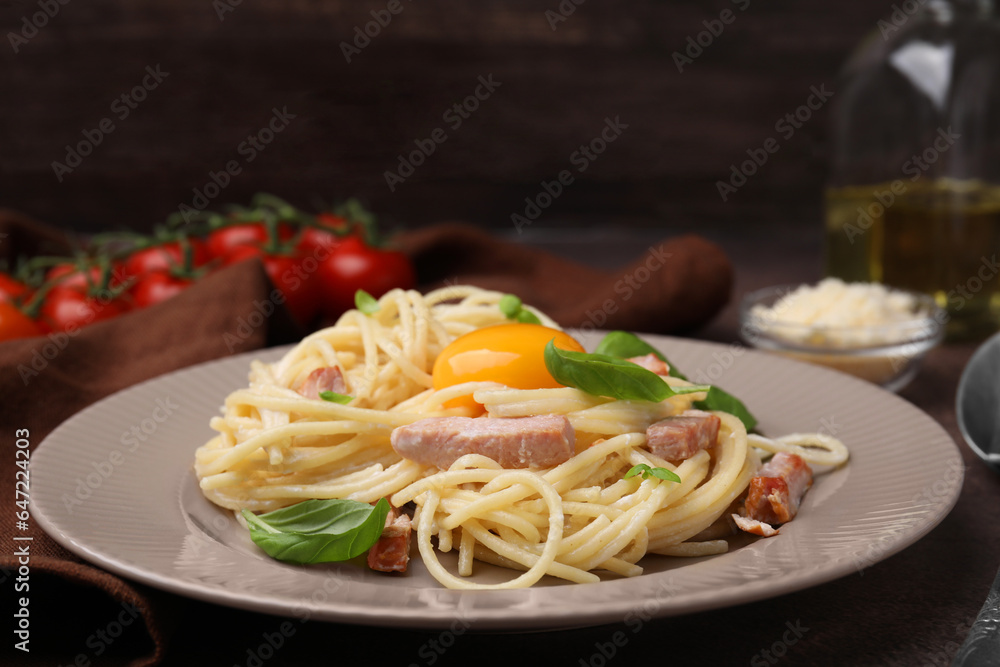 Delicious pasta Carbonara with egg yolk on table, closeup Delicious pasta Carbonara with egg yolk on table, closeup