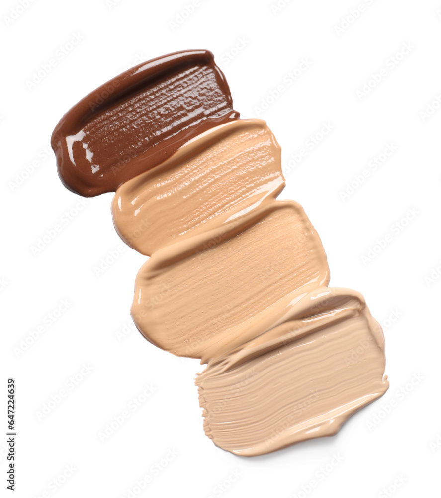 Samples of skin foundation on white background, top view Samples of skin foundation on white background, top view