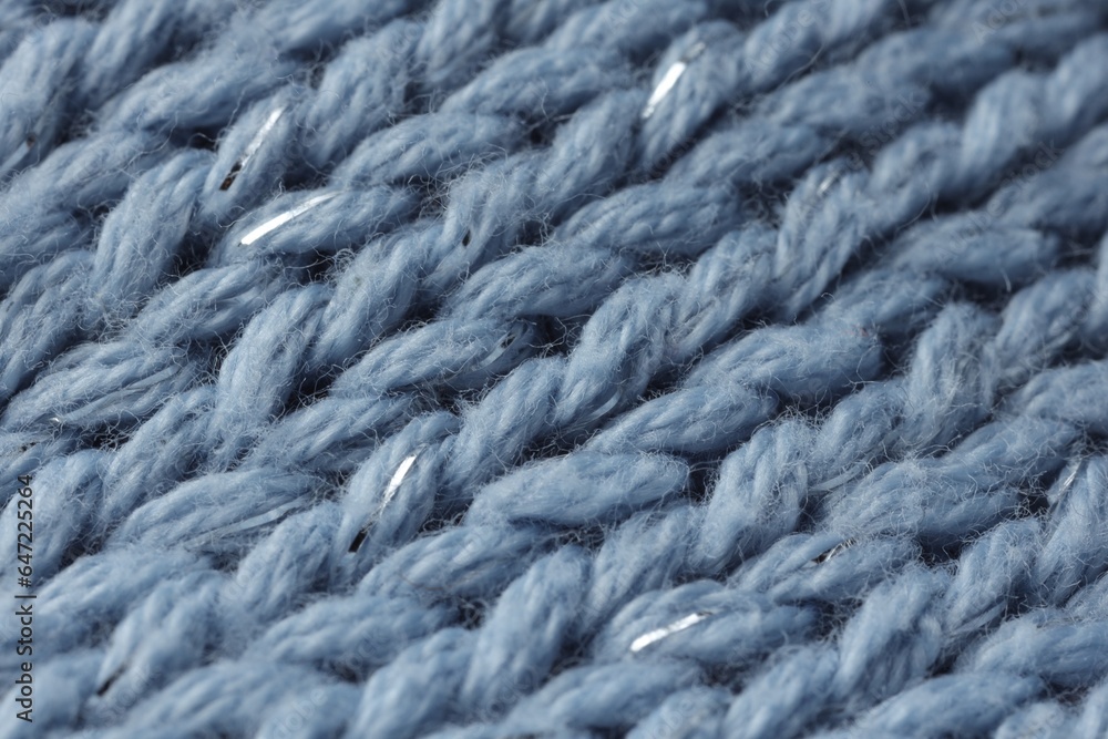Light blue knitted fabric as background, macro