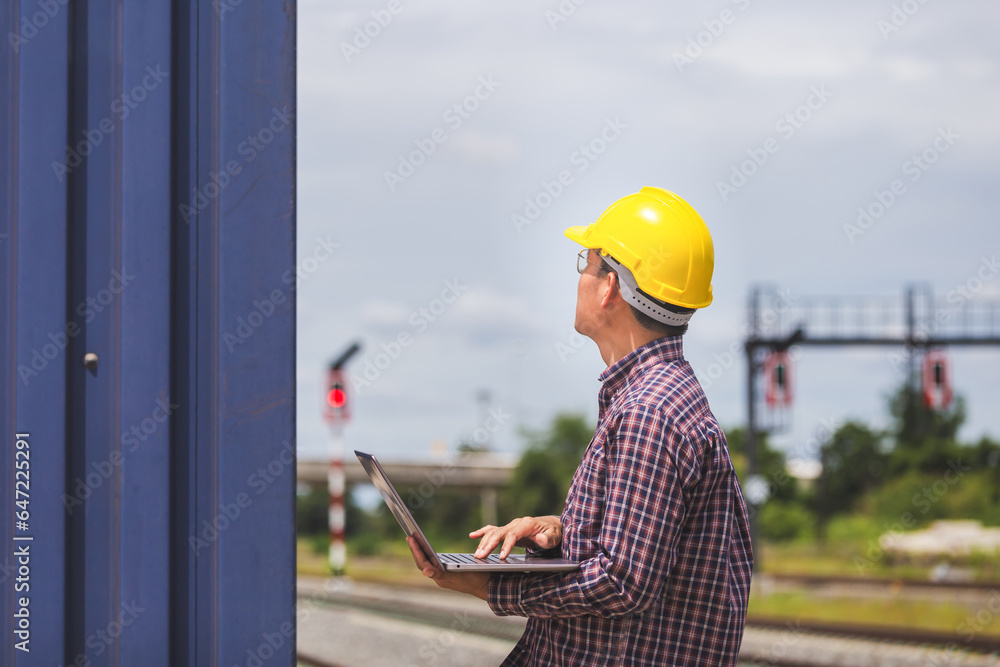 Foreman in hardhat control loading containers box from cargo, Engineer with laptop, Industrial worker in industry containers cargo Foreman in hardhat control loading containers box from cargo, Engineer with laptop, Industrial worker in industry containers cargo