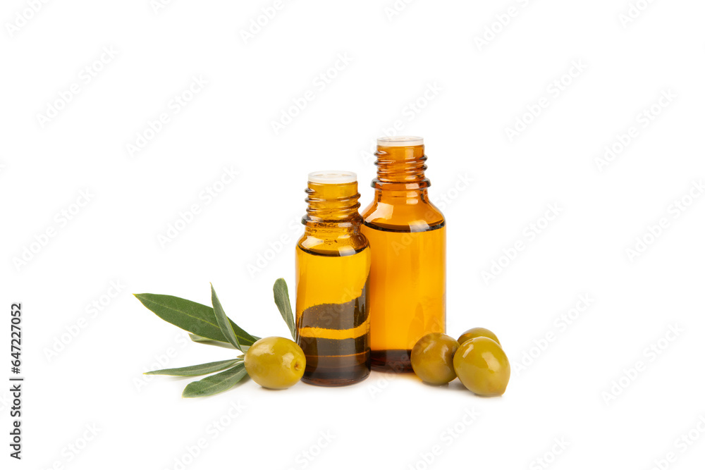 Olive essential oil. Glass bottle with olive oil isolated on a white background. Cosmetic oil. Olive essential oil. Glass bottle with olive oil isolated on a white background. Cosmetic oil.