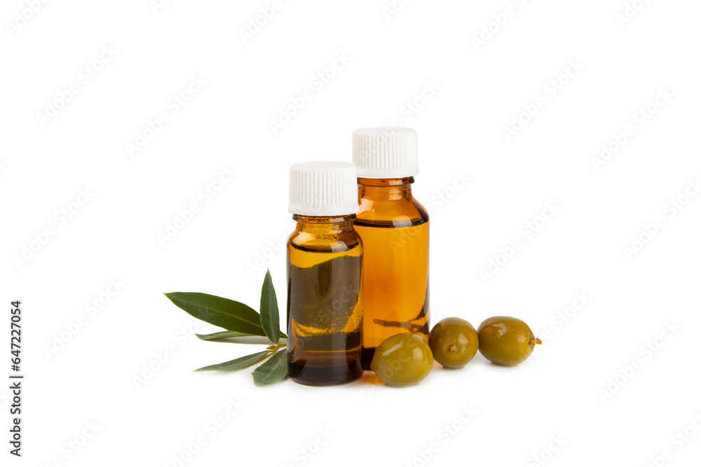 Olive essential oil. Glass bottle with olive oil isolated on a white background. Cosmetic oil. Olive essential oil. Glass bottle with olive oil isolated on a white background. Cosmetic oil.