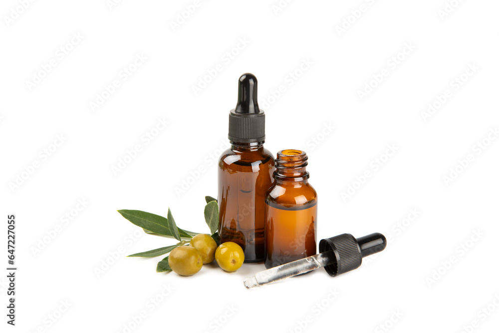 Olive essential oil. Glass bottle with olive oil isolated on a white background. Cosmetic oil. Olive essential oil. Glass bottle with olive oil isolated on a white background. Cosmetic oil.