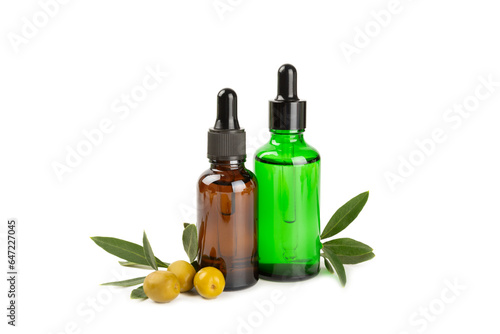 Olive essential oil. Glass bottle with olive oil isolated on a white background. Cosmetic oil.