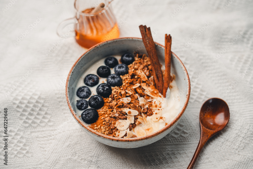 Fototapeta premium Yogurt Bowl with Cinnamon Granola and Blueberries