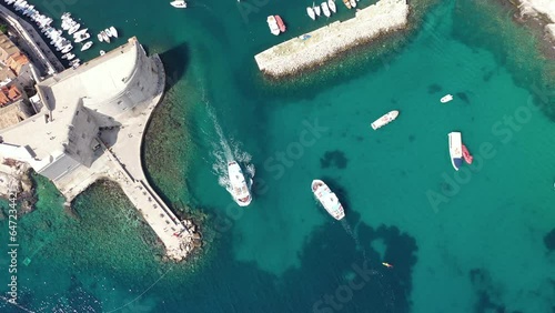 Dubrovnik old town. Aerial view of historic city of Dubrovnik in Croatia. Famous tourist attraction in the Mediterranean. Summer. Old port by the Adriatic sea.