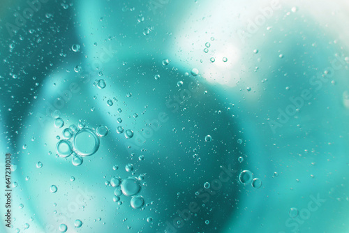 Oil bubbles close up. circles of water macro. abstract light blue background