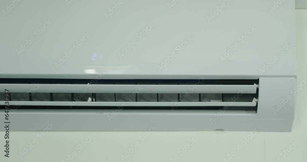 Air conditioner operation, flow louvers move up and down. Front view Air conditioner operation, flow louvers move up and down. Front view
