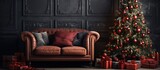 Christmas themed living room with an elegant red sofa cozy armchair and gift studded Christmas tree