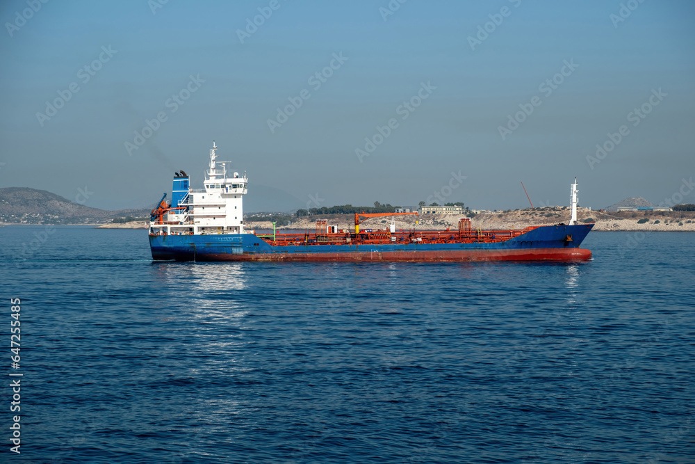 Container cargo ship loaded leaves Piraeus port, Greece. Import export business and logistics.
