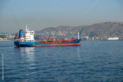 Container cargo ship loaded arrives at Piraeus port, Greece. Import export business and logistics.