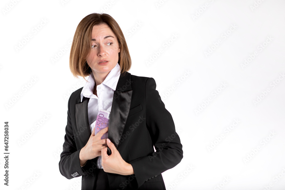 Close-up photo of cunning businesswoman hiding pack of cash money in her jacket isolated on white background Close-up photo of cunning businesswoman hiding pack of cash money in her jacket isolated on white background