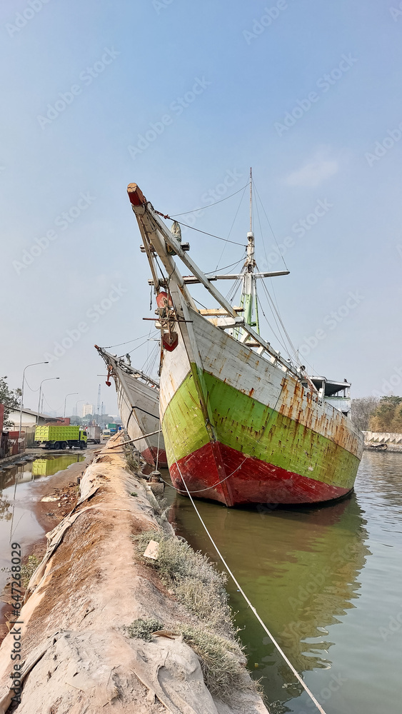 Fototapeta premium Sunda Kelapa old Harbour with fishing boats, ship and docks in Jakarta, Indonesia